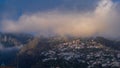 Sunset over houses on hill in Funchal, Madeira, Portugal timelapse Royalty Free Stock Photo