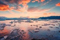 Sunset over iceberg and ice breaking floating in Jokulsarlon glacier lagoon, Vatnajokull national park, Iceland