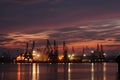 Sunset over an industry harbor with cranes in Bulgaria, Varna Royalty Free Stock Photo