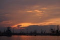 Sunset over an industry harbor with cranes in Bulgaria, Varna Royalty Free Stock Photo