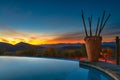 Sunset over infinity pool in a Namibian resort in Opuwo Royalty Free Stock Photo