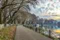 Sunset over Ioannina city and lake Pamvotis. Street for pedestrians and bicycles by the lake. Epirus, Greece Royalty Free Stock Photo