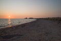 Sunset over Ionian Sea, twilight on wild beach Royalty Free Stock Photo