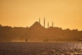 Sunset over Istanbul Silhouette wih City line ferry and boats. Traditional arabic town with silhouettes of minarets on sunset, Royalty Free Stock Photo