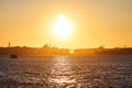 Sunset over Istanbul Silhouette wih City line ferry and boats. Traditional arabic town with silhouettes of minarets on sunset, Royalty Free Stock Photo