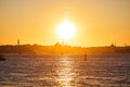 Sunset over Istanbul Silhouette wih City line ferry and boats. Traditional arabic town with silhouettes of minarets on sunset, Royalty Free Stock Photo