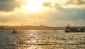 Sunset over Istanbul with a view of the Suleymaniye  Mosque and City line ferry and boats. Traditional arabic town with Royalty Free Stock Photo