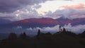 Sunset over Jamnik, Slovenia. Rainbow, Alps and Church of St. Primoz, aerial drone view