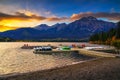 Sunset over jetty with boats on the Pyramid Lake in Jasper National Park, Canada