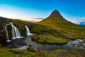 Sunset over the Kirkjufellsfoss Waterfall with Kirkjufell Mountain Royalty Free Stock Photo