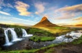 Sunset over Kirkjufellsfoss Waterfall and Kirkjufell mountain in