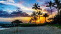 Sunset over the Lagoon and beach with Palm trees and colorful sky