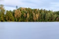 Sunset over the lake in the background of the forest. Royalty Free Stock Photo