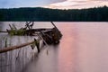 Sunset over the lake in the background of the forest. Royalty Free Stock Photo