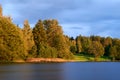 Sunset over the lake in the background of the forest. Royalty Free Stock Photo