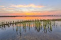 Sunset over lake with lake shore protection