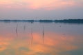 Sunset over lake , Man rows a fishing boat Royalty Free Stock Photo