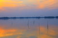 Sunset over lake , Man rows a fishing boat Royalty Free Stock Photo