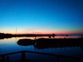 On a pier. Sunset over the lake in Rabocheostrovsk, Karelia. 