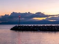 Sunset over the lake. Seagull perching at sunrise. Group of black headed gull standing on rocks in summer. Chroicocephalus Royalty Free Stock Photo