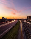 Sunset over Lake Shore Blvd in Humber Bay, with light trails and a Go Train in motion.