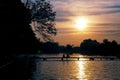 Sunset over the lake .silhouette photography. Romantic moment. Couple on the bridge Royalty Free Stock Photo