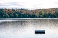 Sunset over lake with dock during Indian Summer in Quebec, Canada Royalty Free Stock Photo