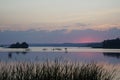 Sunset over the lake. Warm summer quiet evening. Landscape. Horizontal shot Royalty Free Stock Photo