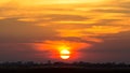 Sunset over lake water with dramatic blue sky Royalty Free Stock Photo