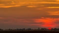 Sunset over lake water with dramatic blue sky Royalty Free Stock Photo