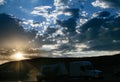 Sunset over large oil and gas shale field in Texas with Trucker in Foreground Royalty Free Stock Photo