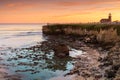 Sunset over lighthouse Field State Beach Royalty Free Stock Photo