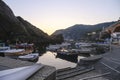sunset over the Ligurian sea, cliffs, and boats on the waves in Framura, Italy. Marina at dusk Royalty Free Stock Photo