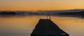 Sunset over a lake and a jetty in Sweden