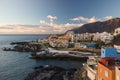 Sunset over Los Gigantes cliffs and resorts of Puerto Santiago