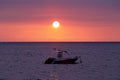 Sunset over Madagascar Nosy be beach with boat silhouette Royalty Free Stock Photo