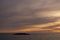 Sunset over the Mediterranean through cloudy winter skies