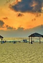 Sunset over the Mediterranean Sea, seashore with a beach. Summer evening