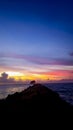 sunset over the mid-ocean bridge and small tree