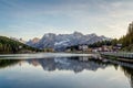 Sunset over Misurina Lake with sky reflection in calm water. View on the majestic Dolomites Alp Mountains, National Park Tre Cime Royalty Free Stock Photo