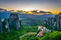 Sunset over monasteries of Roussanou and Saint Nicholas Anapavsa at Meteora, Greece Royalty Free Stock Photo