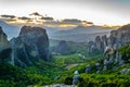 Sunset over monasteries of Roussanou and Saint Nicholas Anapavsa at Meteora, Greece Royalty Free Stock Photo