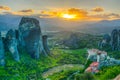 Sunset over monasteries of Roussanou and Saint Nicholas Anapavsa at Meteora, Greece Royalty Free Stock Photo