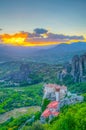 Sunset over monasteries of Roussanou and Saint Nicholas Anapavsa at Meteora, Greece Royalty Free Stock Photo