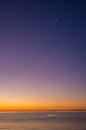 Sunset over Mornington Peninsula with new moon high up Royalty Free Stock Photo