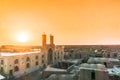 Sunset over mosque of Ghoortan citadell by village of Varzaneh - Royalty Free Stock Photo