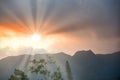 Sunset over a mountain rnage with sunrays Royalty Free Stock Photo