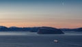 The sunset over the mountains in the beginning of the winter