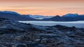 The sunset over the mountains in the beginning of the winter