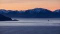 The sunset over the mountains in the beginning of the winter